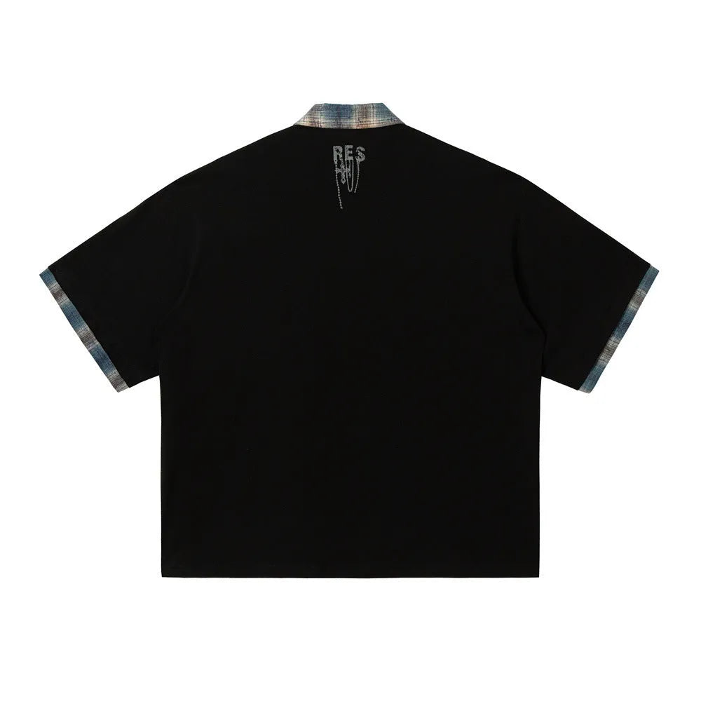 Men's loose blue cotton short-sleeve top with asymmetric cut and graffiti print on lapel.