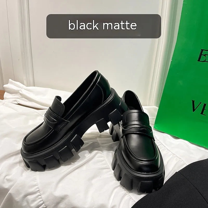 British style wide fit patent leather loafers with a muffin heel and rubber sole.