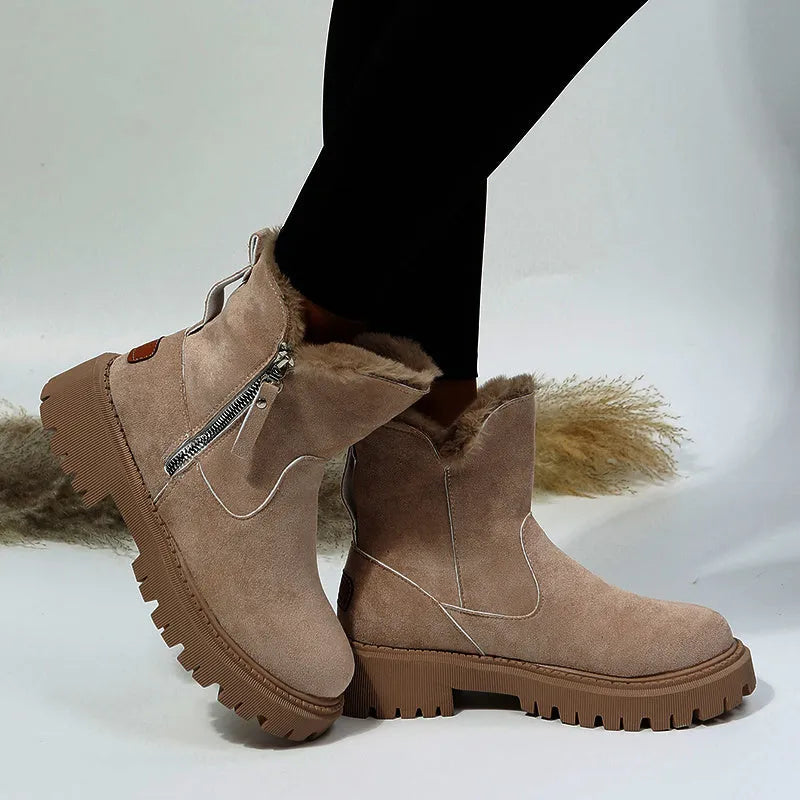 Women's black faux suede high-top snow boot with side zipper on a non-slip rubber sole.