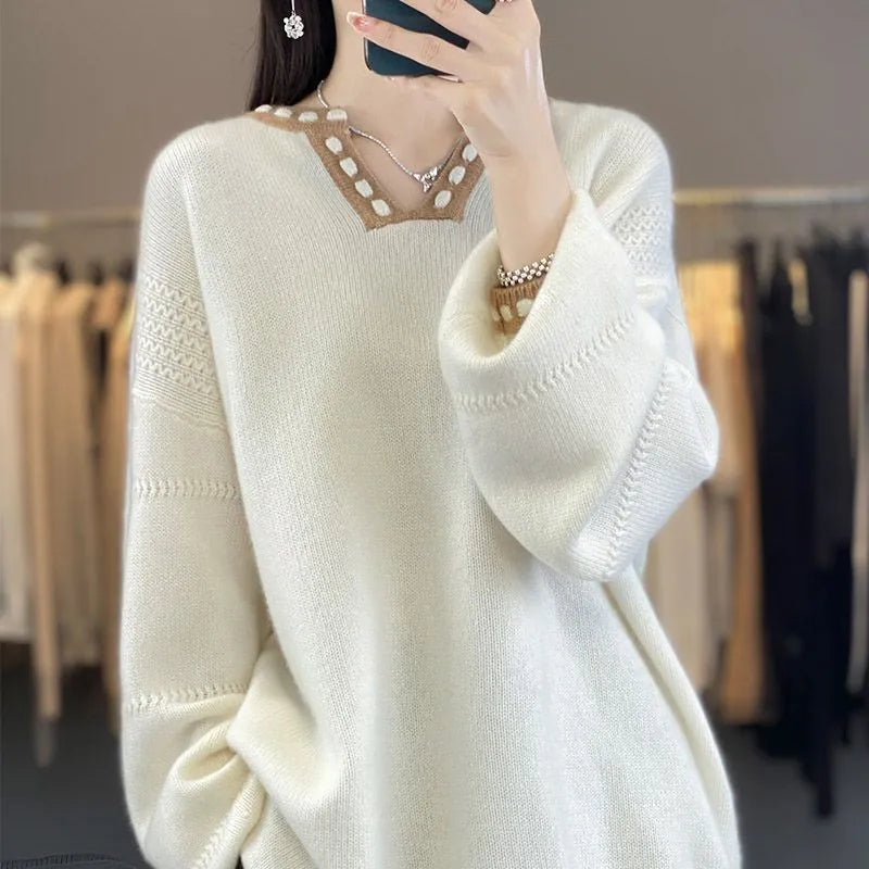 Women's camel V-neck viscose sweater with long sleeves on a hanger.