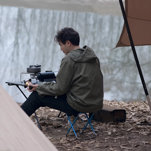 Black aluminium alloy folding stool in a folded and unfolded state.