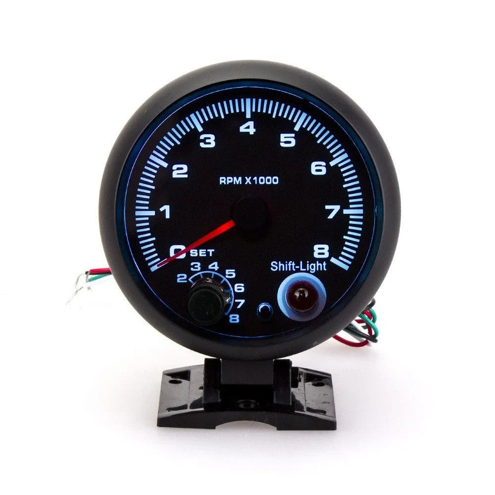 Black automotive tachometer with blue light pointer display for RPM measurement