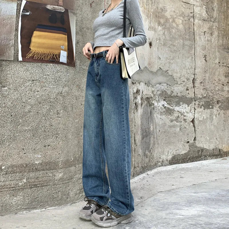 Women's high-waisted retro blue straight-leg jeans in 100% cotton denim laid flat.