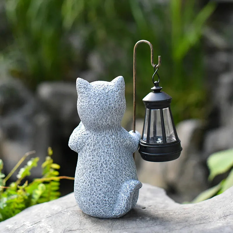 Pastoral style resin solar garden lamp with kitten lifting design for outdoor decoration