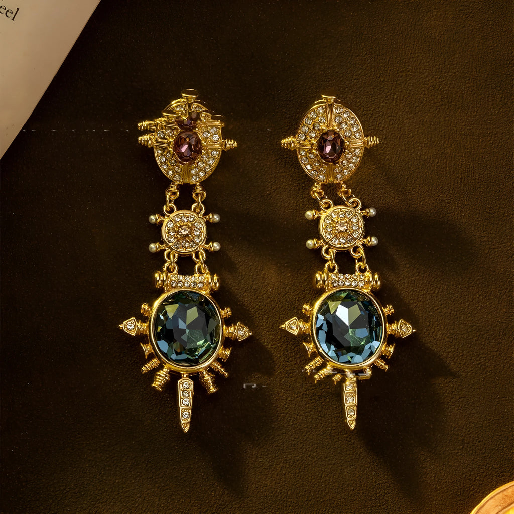 A pair of gold geometric retro-style alloy stud earrings with round diamond-treatment details.