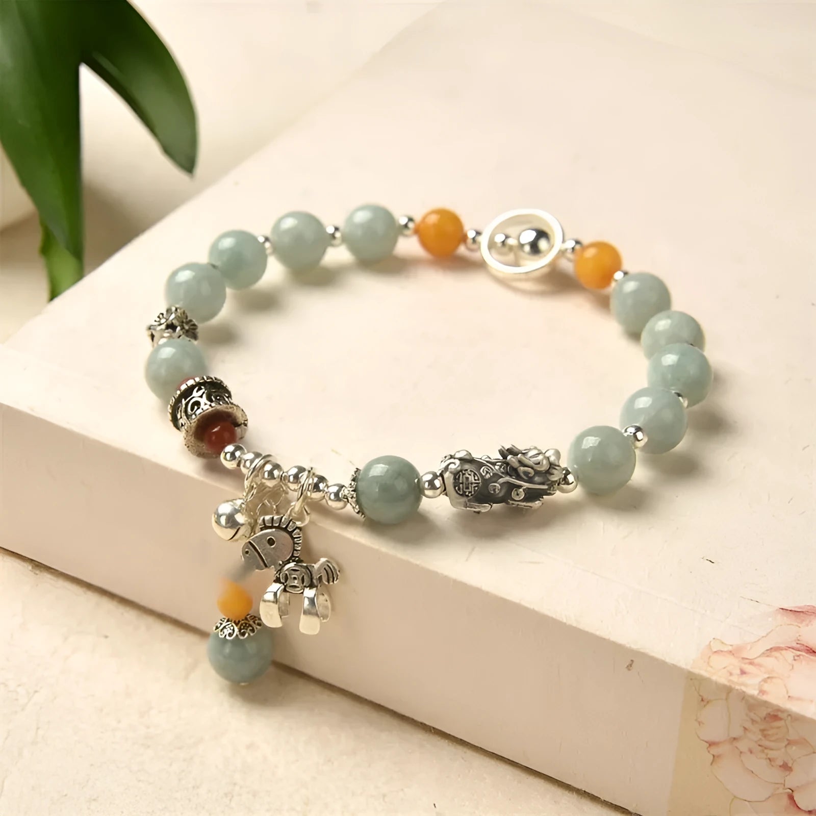 Natural jade vintage bracelet with alloy clasp on a white background.