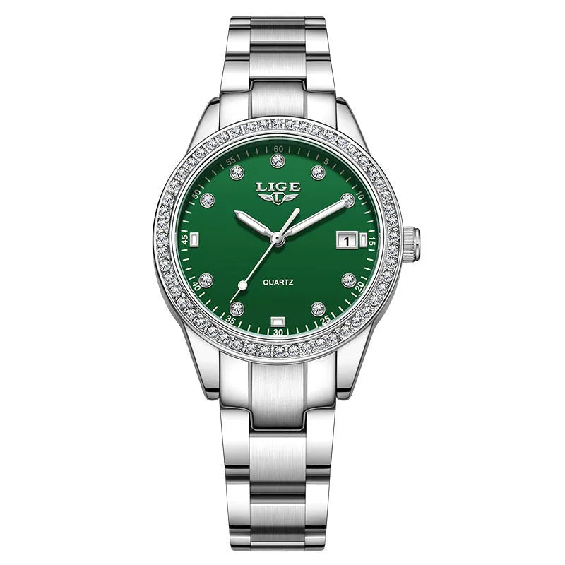 Women's silver fashion watch with diamond bezel, round white dial, luminous hands, and stainless steel bracelet.