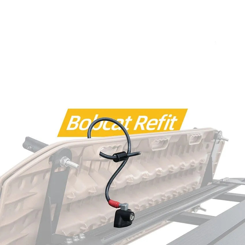 Steel cable fixed lock with plastic-sheathed cables for securing equipment on a vehicle roof platform.