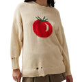 Women's loose-fitting milky white acrylic sweater with jacquard pattern and round neck.
