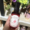 Six pomegranate skin care products including cleanser, water, milk, essence, cream, and eye cream