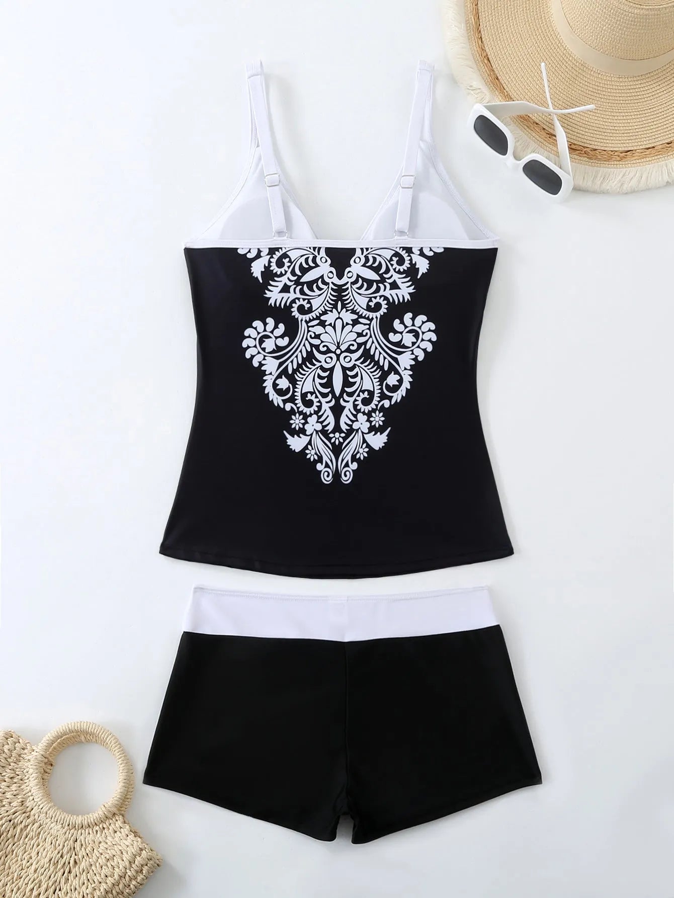Women's plus size printed swimsuit in black or rose red with briefs style.