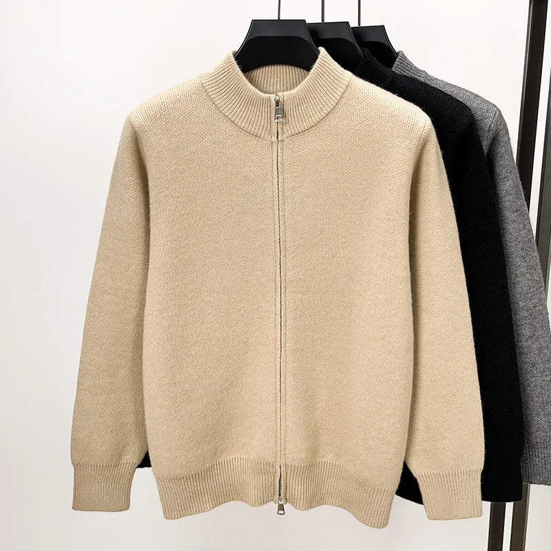 Men's black knitted zip-up cardigan with a stand collar, shown in a loose fit.