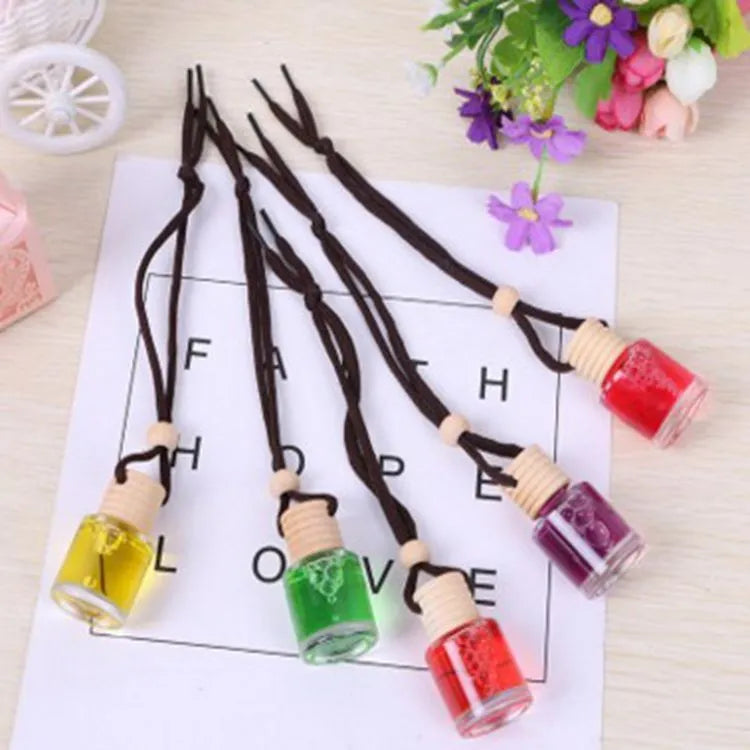 Glass bottle car air freshener hanging ornament with six fragrance options including lavender, lemon and apple scents