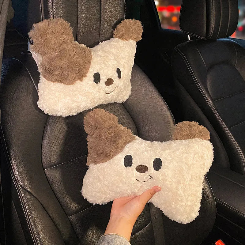 Puppy plush car headrest cushion and matching lumbar support pillow on a car seat.