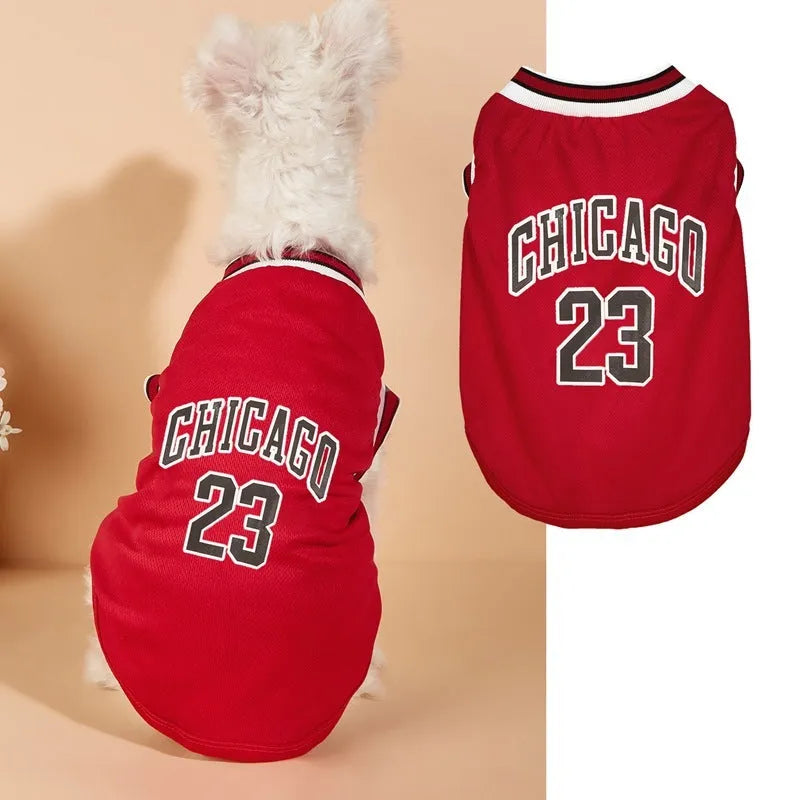 Mesh polyester dog basketball vest in black with basketball design, side view on a white background