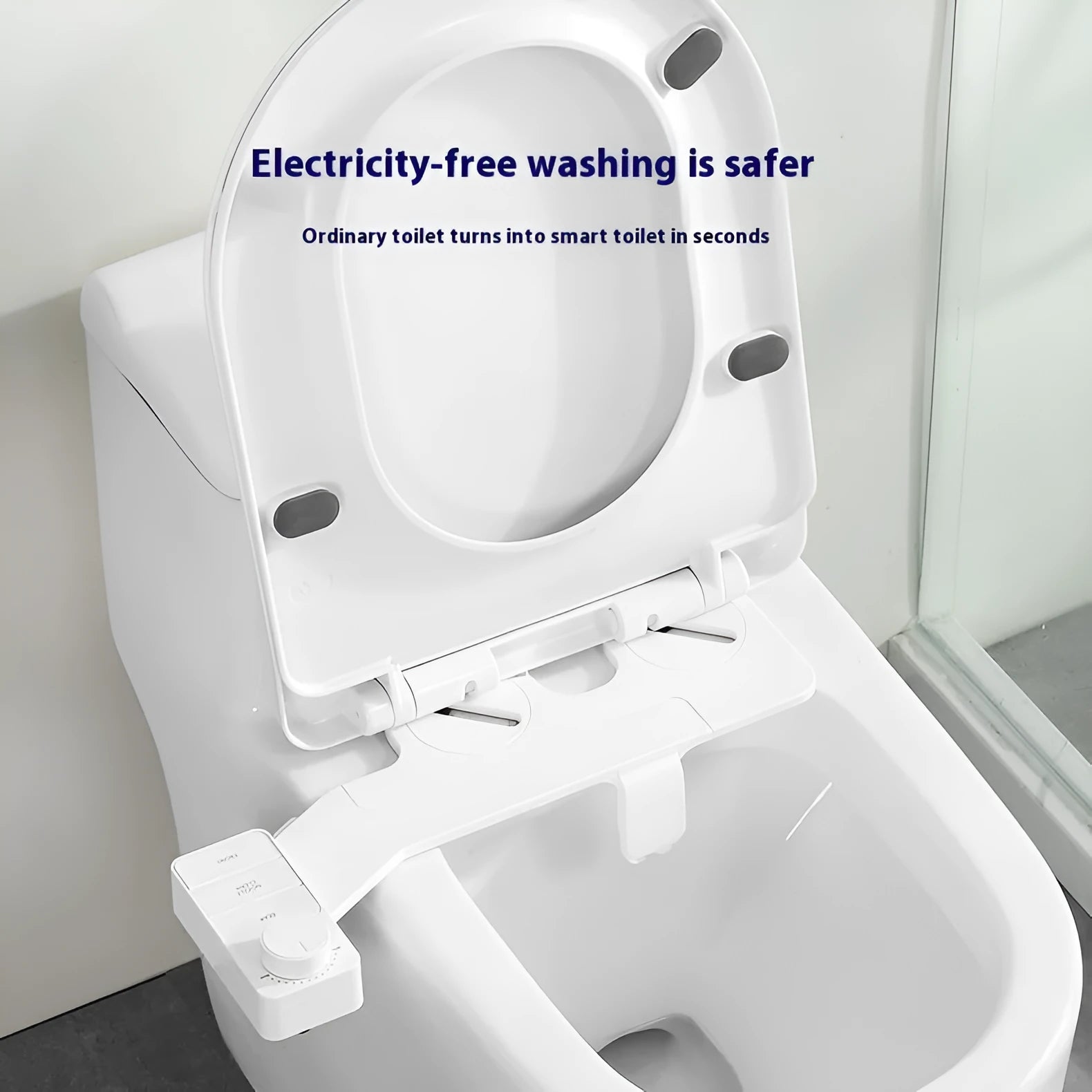 Pure white button-operated wash tool with removable nozzle and regional plumbing fittings.