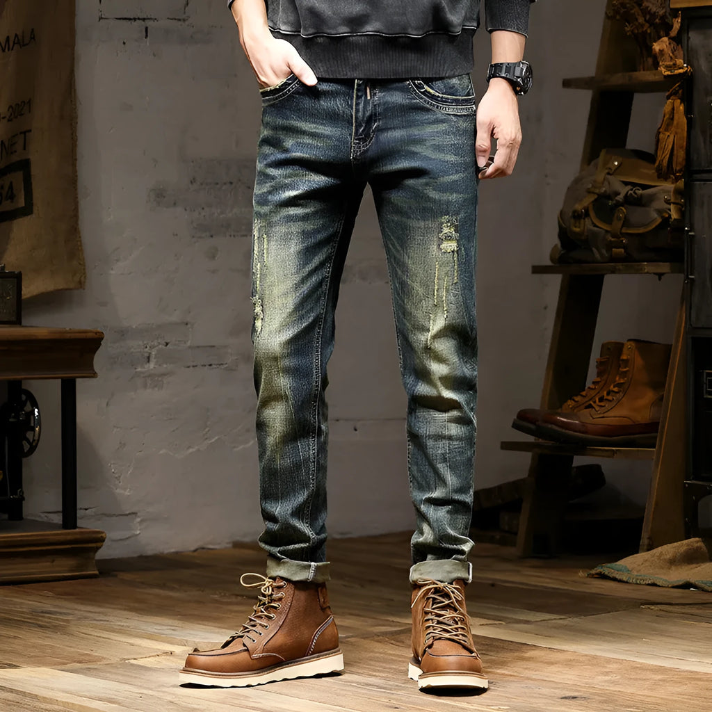 Men's slim-fit retro colour jeans with a zip fly, laid flat to show the skinny pant style.