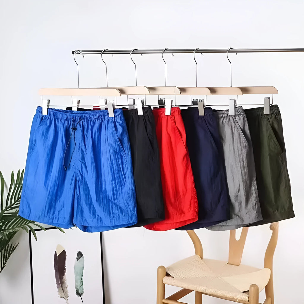Men's quick-drying straight-leg sports shorts in polyester blend fabric, shown in multiple colour options