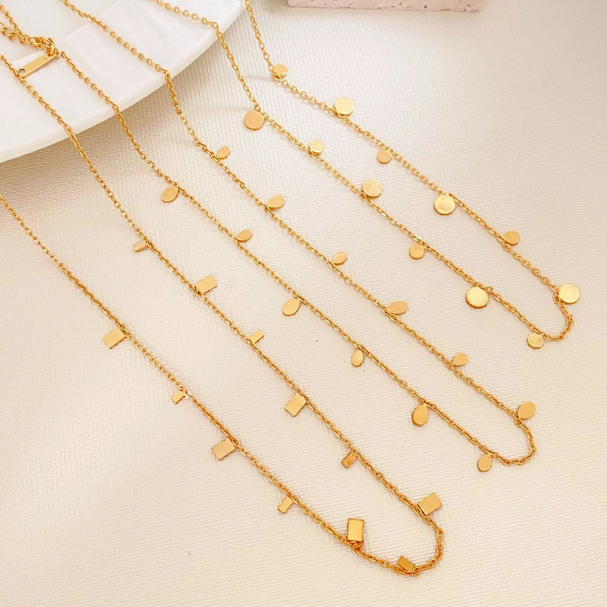 Gold electroplated titanium steel geometric pendant necklace for women in round slice, square, or water drop shape