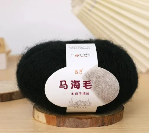 Single 100g ball of mohair yarn for a DIY hand-woven scarf kit, showing the fluffy texture.