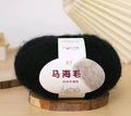 Single 100g ball of mohair yarn for a DIY hand-woven scarf kit, showing the fluffy texture.