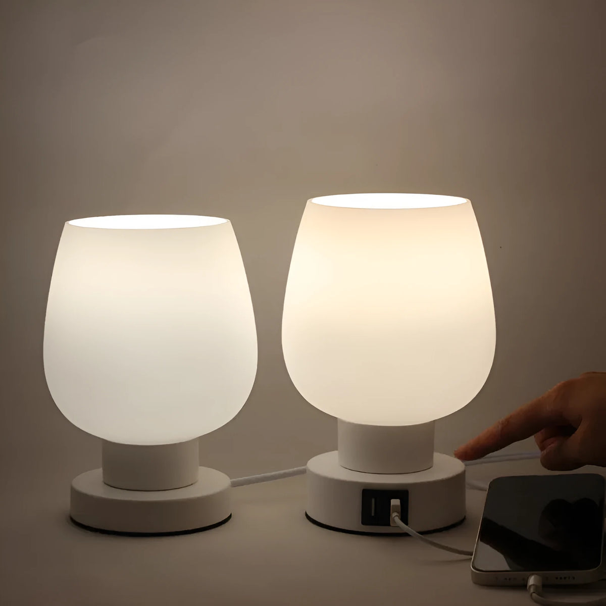 Nordic touch glass desk lamp with three colour modes and USB power on a bedside table