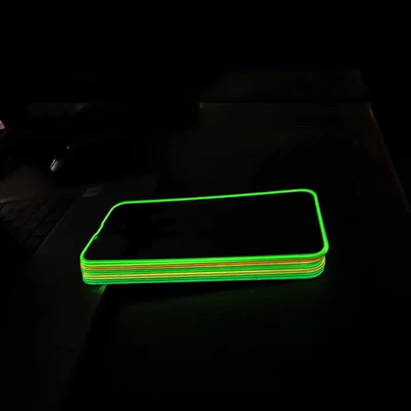 Glow-in-the-dark pink tempered glass screen protector fitted on an iPhone 13 Pro Max showing full-screen coverage.