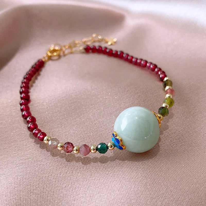 Women's aquamarine and garnet bracelet with drop shape stones and electroplated tourmaline elements