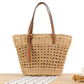 Beige paper string woven large capacity shoulder bag showing horizontal square shape and adjustable strap.