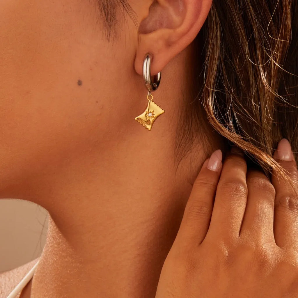 Stainless steel Christmas tree heart earrings with electroplated 18K gold finish showing heart and star shapes