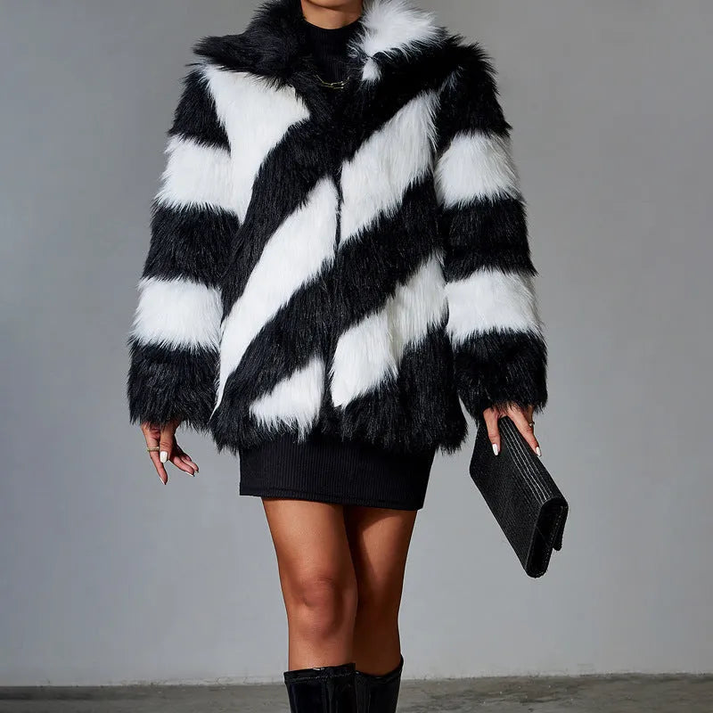 Minimalist faux fur coat with a contrasting colour lapel and a fur collar.