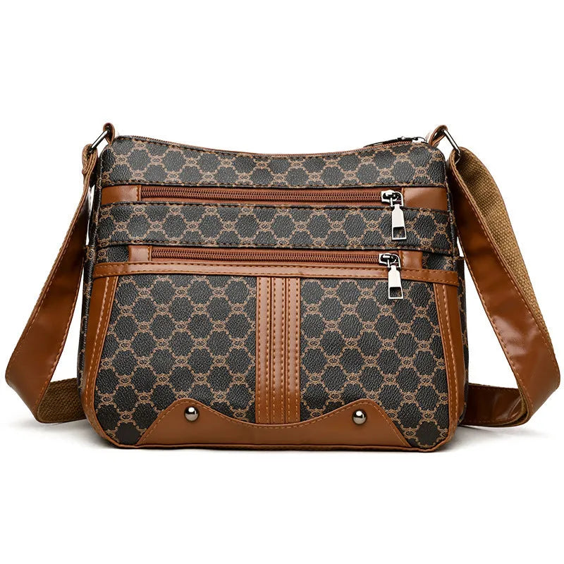 Women's brown and white stitching pattern large-capacity crossbody bag made from PU leather.