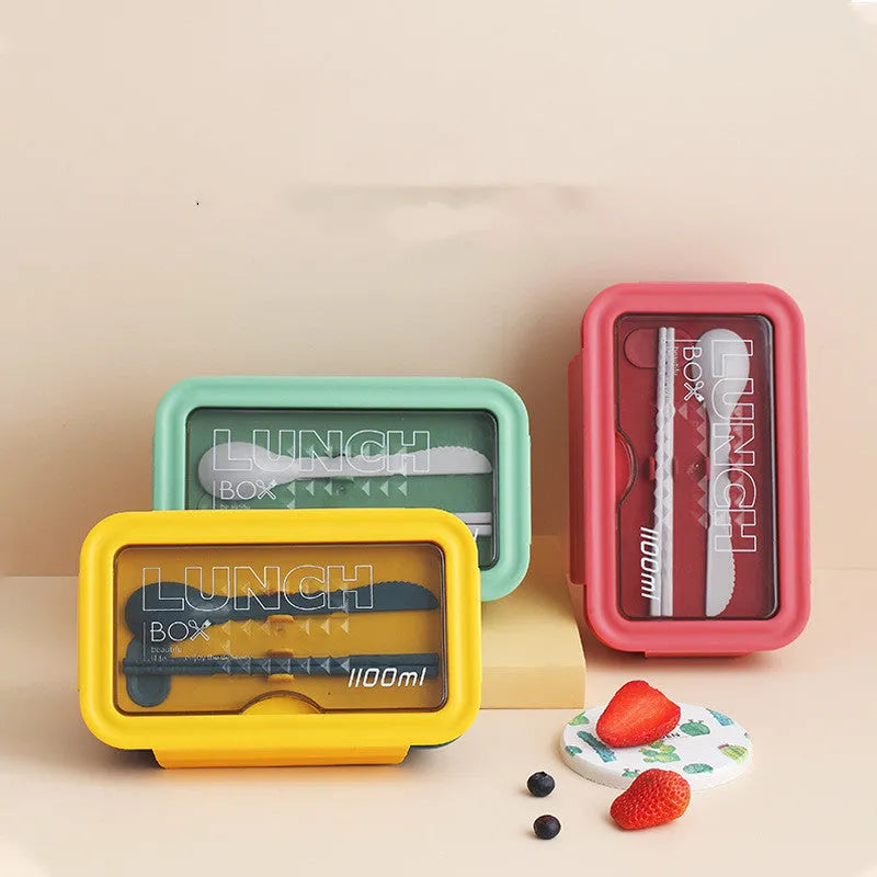 Four-layer partitioned plastic bento lunch box in Nordic style showing green, red and yellow colour options