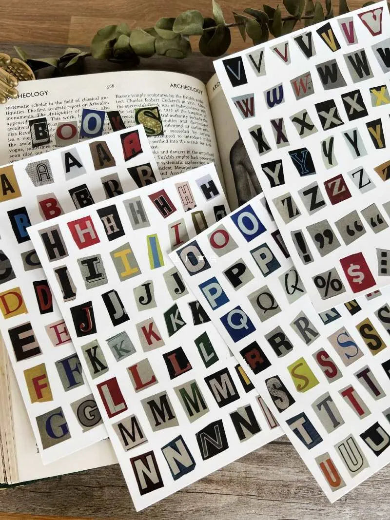 Set of decorative stickers showing English letters, numbers, and weekly words in a cute printed style.