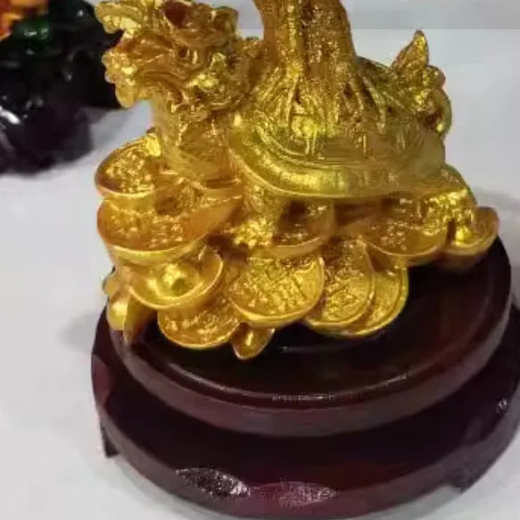 Citrine-coloured resin ornament of a turtle money tree in Chinese Feng Shui style.