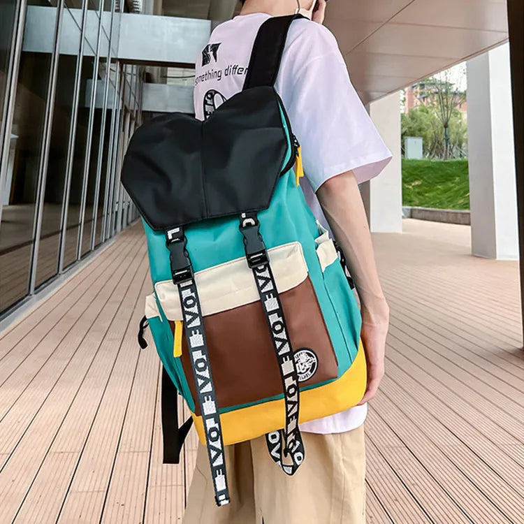 Oxford cloth backpack in black, green, or red, showing handheld and shoulder strap carry options