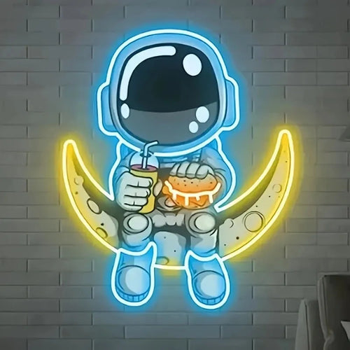 Blue and yellow astronaut-shaped neon light sign mounted on a wall