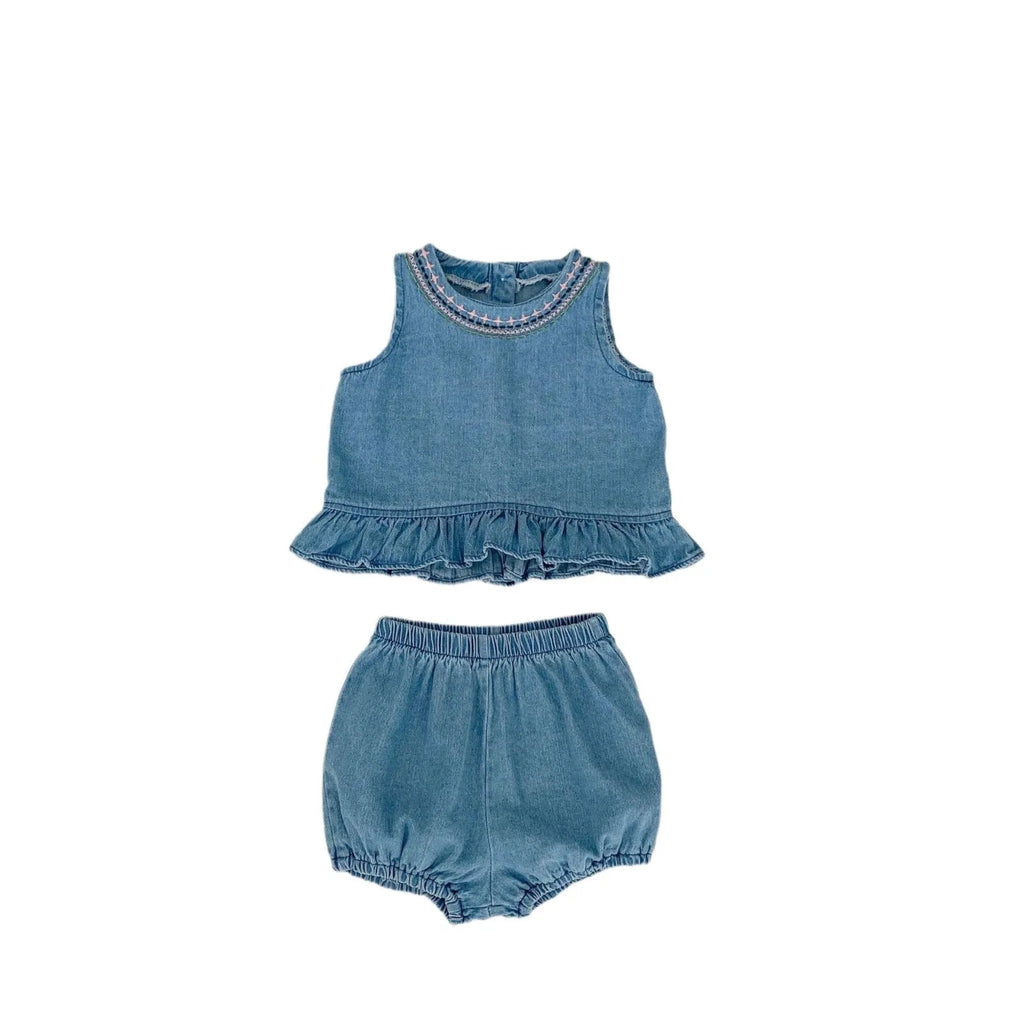 Baby girl denim cotton sleeveless two-piece suit with shorts on a white background