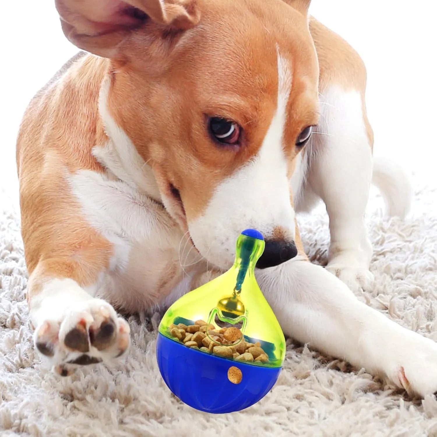 Blue and white tumbler-shaped interactive treat dispenser toy for dogs and cats on a wooden floor.