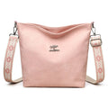 Soft PU leather women's crossbody bag in grey, pink, or yellow with an adjustable strap