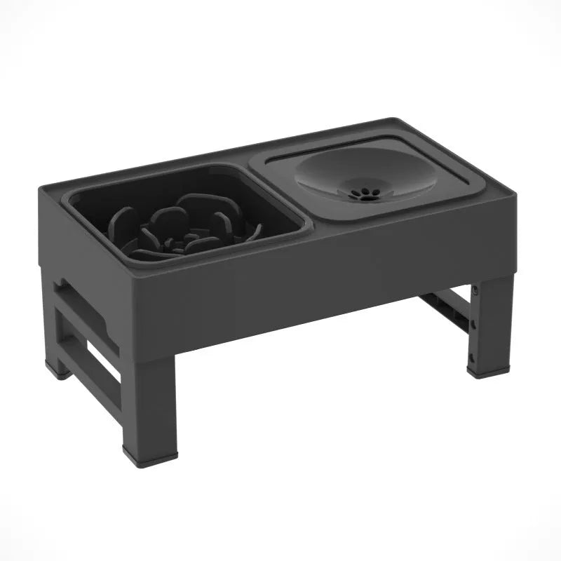 Adjustable height elevated dog feeder with slow feed and water bowls in black and grey.