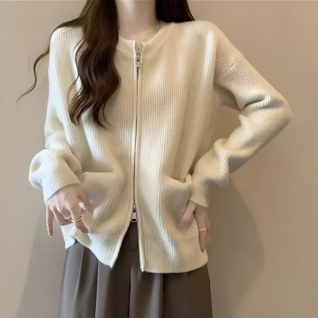 Beige women's long sleeve viscose cardigan sweater coat on a hanger
