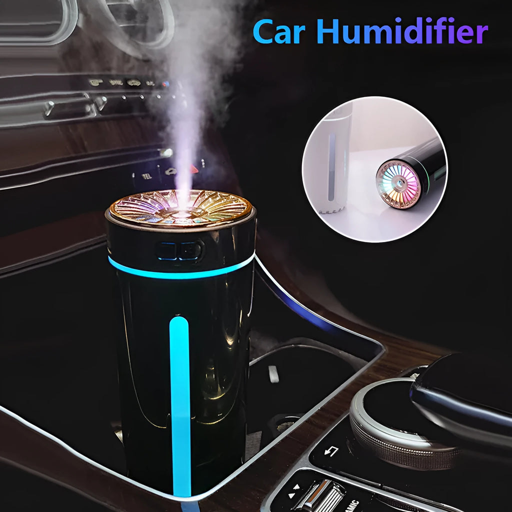 Black USB car humidifier with LED lights placed in vehicle cup holder showing mist output