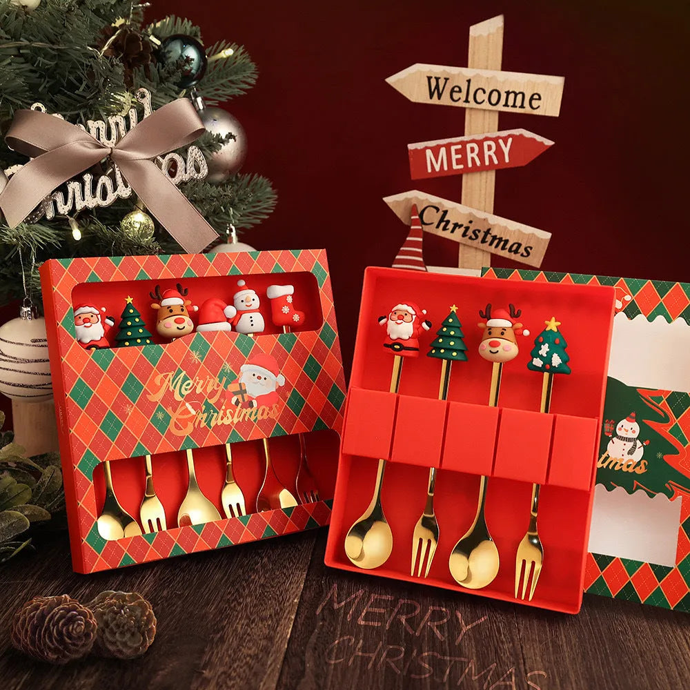 Red stainless steel Christmas spoon and fork set with tree and snowman patterns on handles