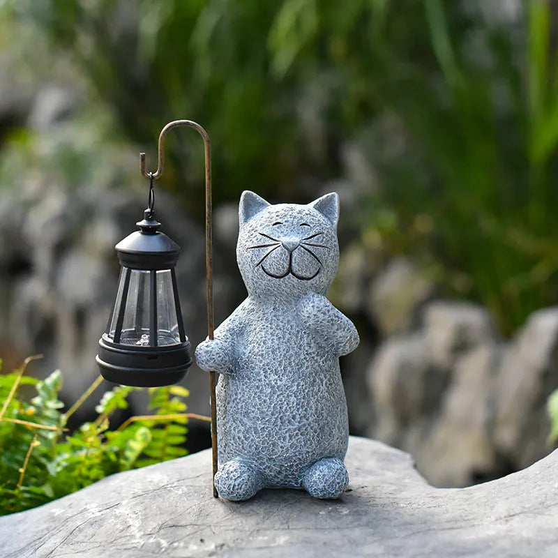 Pastoral style resin solar garden lamp with kitten lifting design for outdoor decoration
