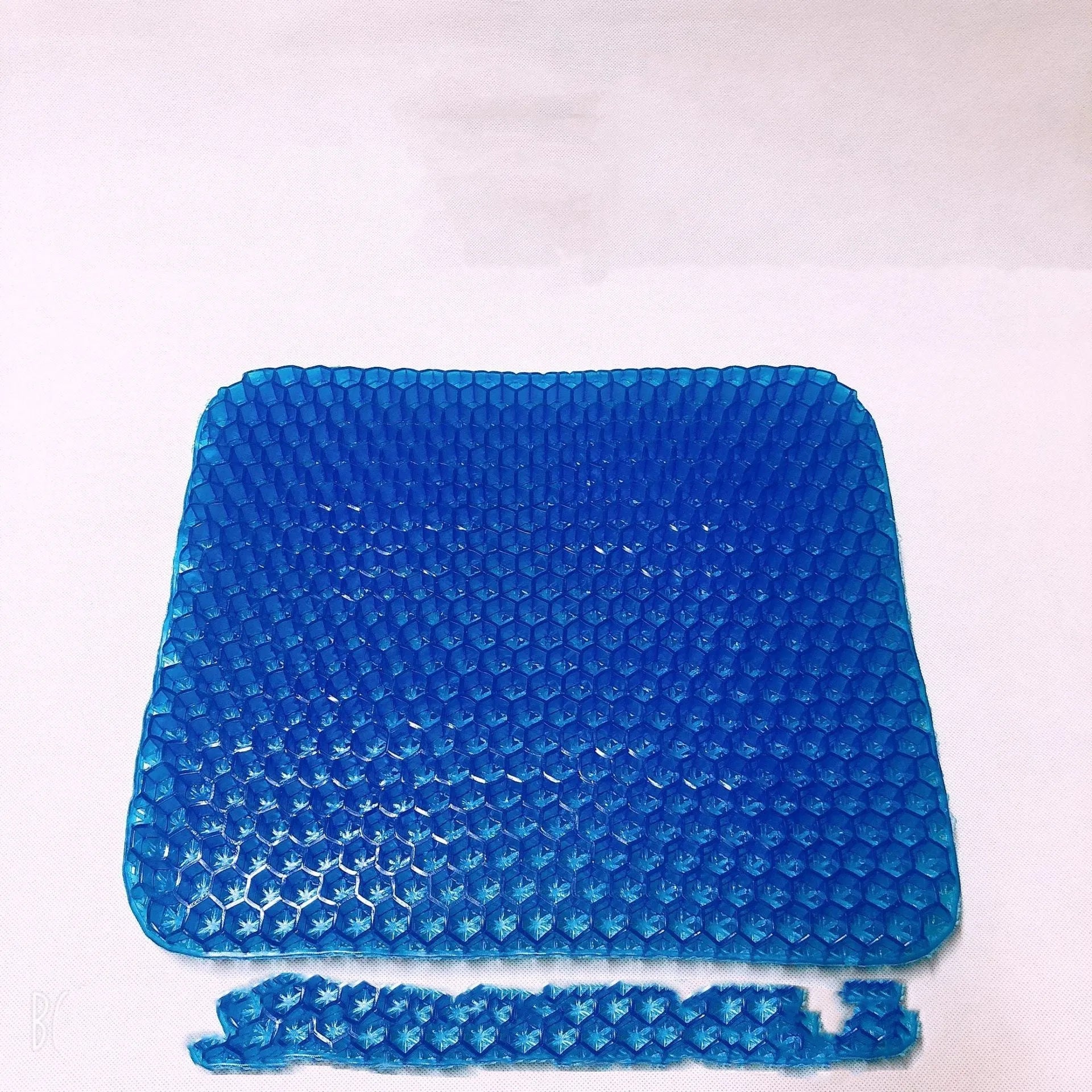 Gel seat cushion with honeycomb pattern showing removable PVC cover and measuring 24.5x17.5x3 cm