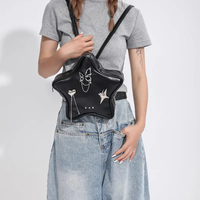 Black PU leather backpack with metal chain trim and star pendant on strap
