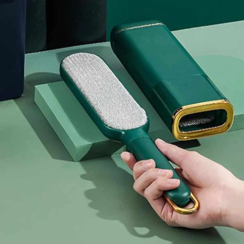 Blue reusable pet hair remover brush with a self-cleaning storage box base.