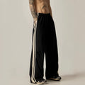 Black wide-leg climbing trousers for men with high waist and straight-leg design.