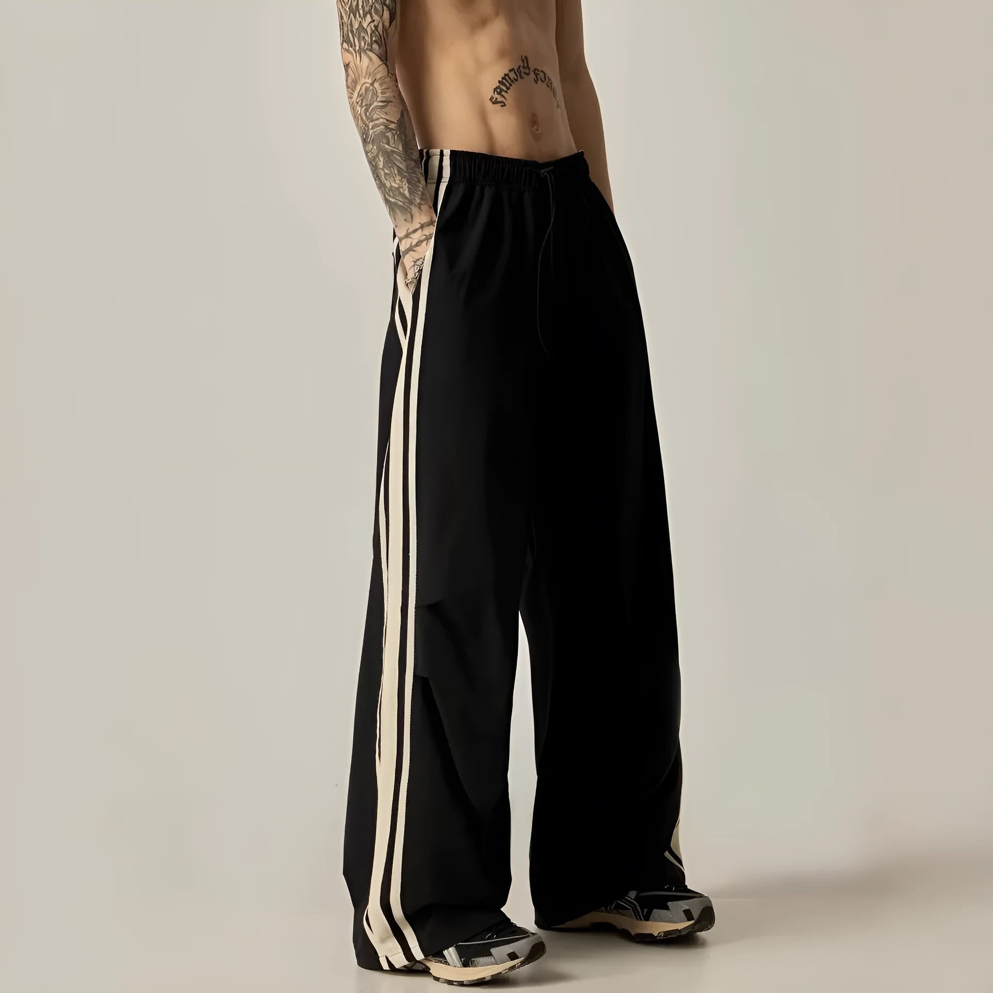 Black wide-leg climbing trousers for men with high waist and straight-leg design.